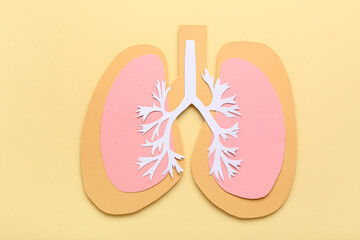 Paper lungs on beige background