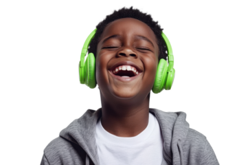 Joyful African American boy with green headphones laughing on transparent background Concept of music, happiness, childhood, and technology