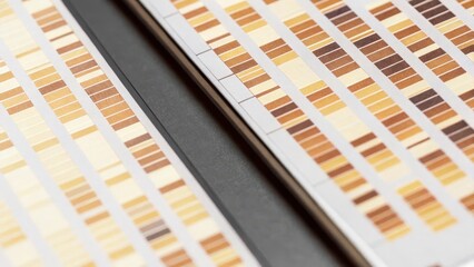 A closeup of a virtual lab environment showcasing software analyzing DNA fragments with digital tools hovering in space illustrating various genetic markers in bold colors.