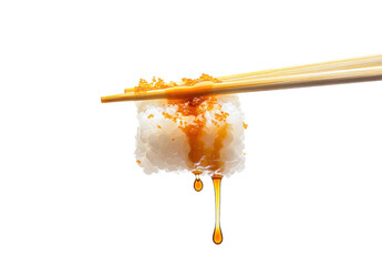 Delicious sushi roll with tobiko held by chopsticks, dripping with soy sauce on a transparent background Concept of Japanese cuisine, food photography, and gourmet dining