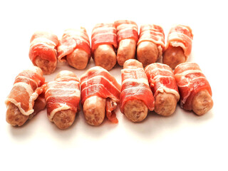 Pigs in blanket on a white color background. Simple pork meat food for a party or starter.