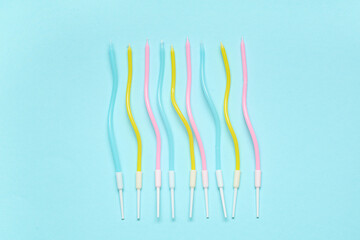 Many colorful Birthday candles on blue background