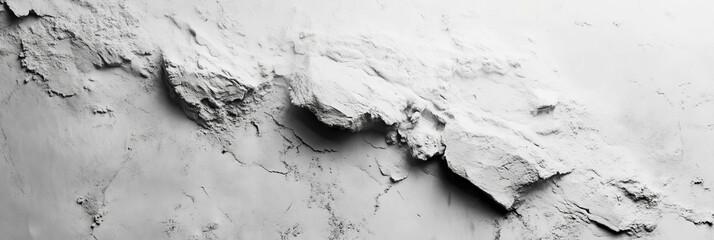 Textured surface of a white wall showing chalk dust and subtle grey smudges