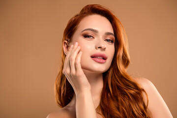 Fototapeta premium Photo of attractive stunning woman touch soft cheek face closed eyes naked shoulders isolated on beige color background