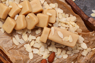 Tray with tasty marzipan and almond flakes, closeup