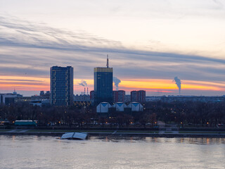 Belgrade sunset cityscape over Sava river with modern buildings