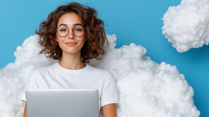 Young woman with curly hair wearing glasses working on laptop while sitting on fluffy clouds against a bright blue background, digital nomad lifestyle concept