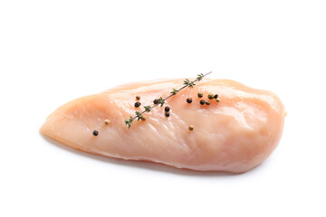 Raw chicken breast with thyme and peppercorns on white background