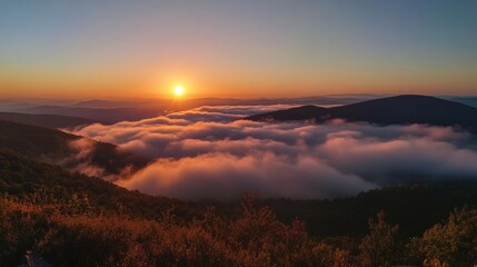 Obraz premium Sunrise over a Sea of Clouds in the Mountains