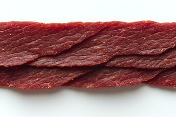Raw beef meat strip isolated on white background, showing fresh red muscle fiber texture and marbling detail, suitable for food industry and culinary design.