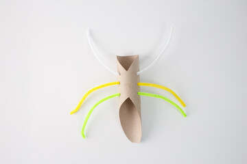 step in creative process, Legs and Antennae, A cardboard tube with pipe cleaners inserted to form...