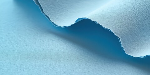 A close-up captures a serene, light blue, textured expanse bisected by a gracefully arched crack. Shadows subtly highlight its depth on one edge, enhancing its allure