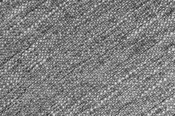 Gray Jacquard fabric with large loose diagonal woven, coarse weave texture upholstery cloth. Textile background, furniture textile material, wallpaper, backdrop. Cloth structure close up, macro.
