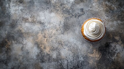 Delicious Vanilla Cupcake with Creamy Frosting on Rustic Background