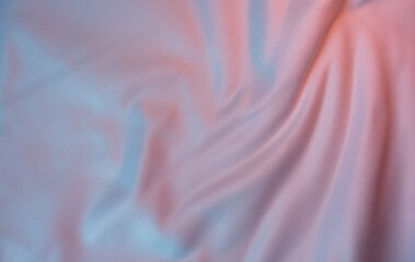 Fototapeta premium Pastel gradient fabric background with soft folds and smooth texture