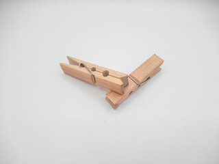 Clothesline clip made of wood with white background 