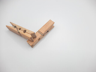Clothesline clip made of wood with white background 