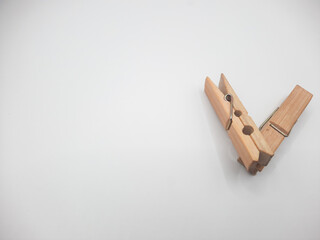 Clothesline clip made of wood with white background 