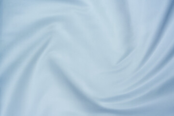 Obraz premium Soft white fabric with smooth folds and swirl pattern