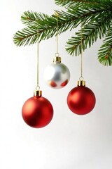 Christmas ornaments hanging from a gold-colored branch isolated on white background, ornaments, gold, winter