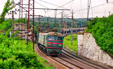 Naklejka premium Soviet-built electric locomotive hauling a freight train near Siversk, currently an active war zone in Russo-Ukrainian War in Donetsk region of Ukraine