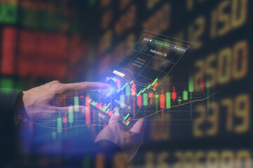 Risk management in investment Businessman or Trader analysing charts virtual screen.Price graph and indicator. Stock market invest and crypto currency. Stock market and business investment