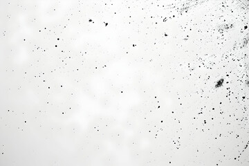 Abstract background with scattered dark particles against a soft white backdrop, creating depth