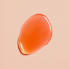 Sheer orange lip oil, skin serum, shampoo or shower gel swatch with a glossy liquid texture on a warm peach background.