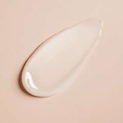Clear hydrating serum, lightweight face moisturizer, or gentle shower gel swatch on a neutral beige background.
