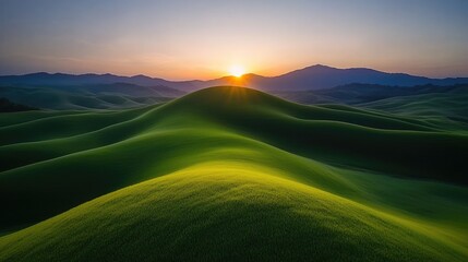 Fototapeta premium Sunrise over rolling green hills, mountain backdrop; nature landscape