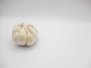 One head of garlic on a white background 