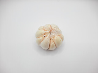 One head of garlic on a white background 