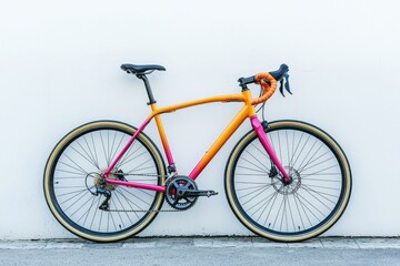 Fototapeta premium Vibrant and Stylish Bicycle Leaning Against a Bare Wall Perfect for Urban Cycling and Lifestyle Photography
