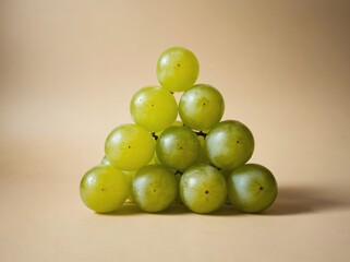 Green Grapes Arranged in a Triangle Shape