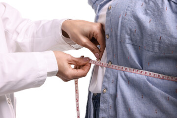 Weight loss. Nutritionist measuring patient's waist with tape on white background, closeup