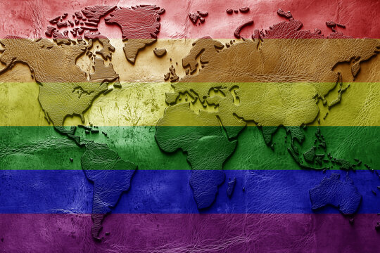 rainbow gay pride Flag on the ancient leather old world map . Adventure concept. Macro shot. Generative Ai