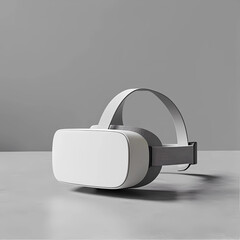 A white virtual reality headset is laying on a table