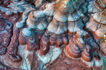 Aerial view of the Bentonite Hills after sunset showing the multi-colored layers of clay and sediment near the Mars Desert Research Station near Hanksville, Utah.