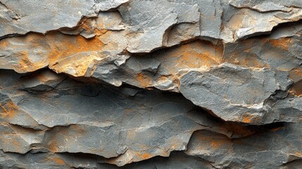 Textured layers of grey and orange rock formations showcasing natural geological patterns