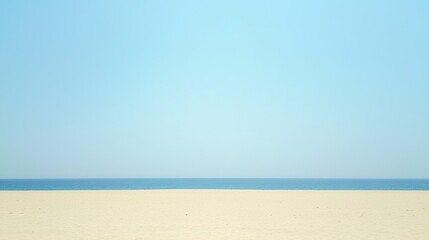 Fototapeta premium Tranquil beach scene with clear blue sky and calm ocean waves, ideal for relaxation themes
