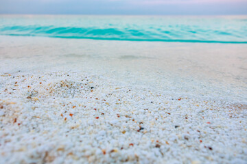A beach with a large body of water in the background