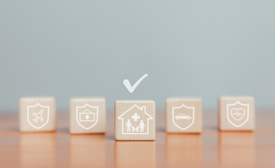 Insurance concept wooden blocks refer to various types of insurance such as insurance, travel, welfare, health insurance plans, home, car, travel, comprehensive coverage.
