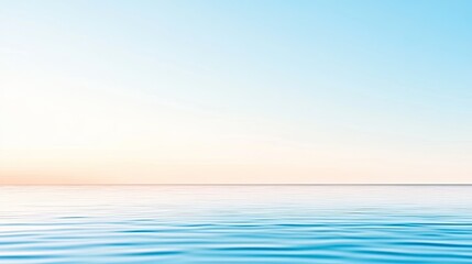 Fototapeta premium Serene ocean view at sunrise with calm waters reflecting soft pastel colors in the sky