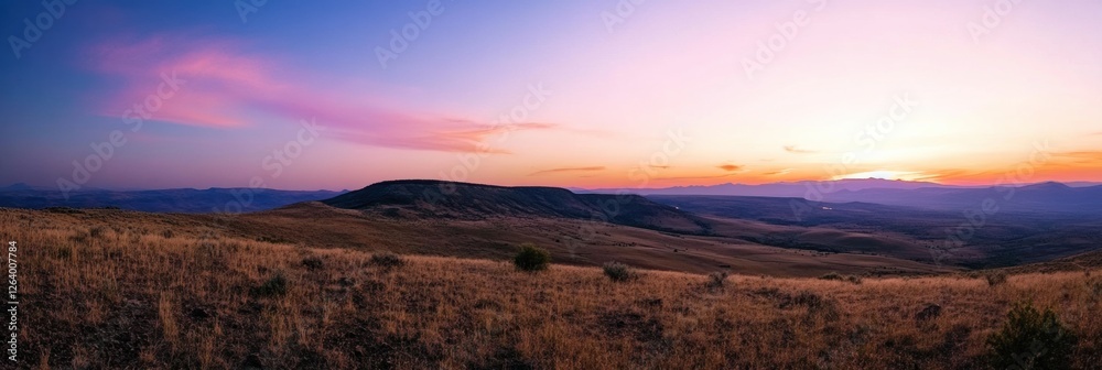 Leinwandbilder Beautiful sunset over rolling hills in a vast landscape with vibrant colors and soft clouds during twilight hours. Generative AI