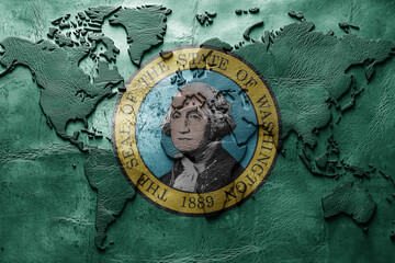 Fototapeta premium Flag of washington state on the ancient leather old world map . Adventure concept. Macro shot. Generative Ai