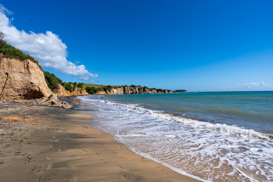 Waves washing onto a black sand beach. Playa Negra, Vieques Puerto Rico.