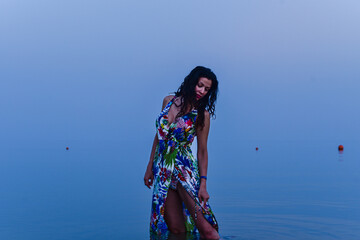 Girl on the beach on Red Sea, merging sea and sky