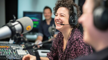 Radio hosts wearing headphones converse enthusiastically in a modern studio, surrounded by professional audio equipment, capturing the essence of dynamic broadcasting and lively interaction