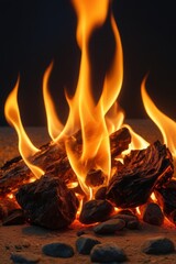 flames are burning in a pile of rocks on a beach