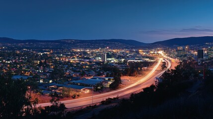 Fototapeta premium Night Highway Cityscape, Mountain View, Traffic Trails, Urban Panorama, Travel